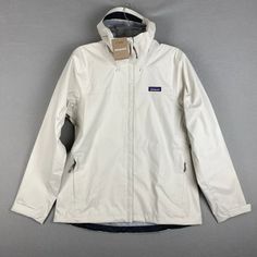 Brand: Patagonia Color: Wool White Size: Xs / Xl / Xxl New With Tags Simple And Unpretentious, Patagonia's Trusted Torrentshell 3l Rain Jacket Meets Patagonia's H2no Performance Standard For Exceptional Waterproof/Breathable Performance. Torrentshell Provides All-Day Comfort And Long-Lasting Waterproof Durability, And The Fabrics, Membrane And Finishes Of This 3-Layer Shell Are Made Without Perfluorinated Chemicals. Product Features: Two Handwarmer Pockets And Venting Pit Zips With Welted Exteri Patagonia Torrentshell, Carabiner Clip, Patagonia Jacket, Patagonia Jackets, Snow Jacket, Patagonia Womens, White Shop, Hand Warmers, Patagonia