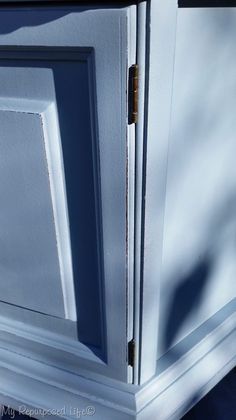 a white cabinet with an open door on the outside