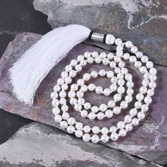 "📿 Wearer of Moti Mala/Pearl Mala can get the blessings of moon, as Moti/Pearl is the gemstone of moon. This rosary is used in saatvik works or for completion of something. Those who are short tempered can wear this rosary as a necklace as it will make you calm. One who wears Moti (Pearl) Mala enjoys good fortune and is blessed by the Maa Laxmi (the goddess of wealth), he becomes sinless, and obtains energy and intelligence. He achieves a high position by his knowledge and becomes renowned. 📿 Spiritual Necklace With Pearl Pendant And Round Beads, Spiritual Pearl Pendant Necklace, Pearl White 8mm Beads Jewelry Gift, Pearl White Jewelry With 8mm Beads As Gift, Pearl White Jewelry With 8mm Beads For Gift, Spiritual Pearl Drop Necklace, Spiritual Pearl Necklace With Round Beads, Spiritual Round Beads Pearl Pendant Jewelry, Spiritual Pearl Drop Necklace With Round Beads