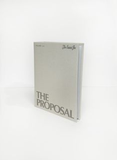 an open book with the words the proposal written in black on it's cover