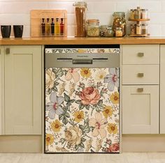 a dishwasher sitting in the middle of a kitchen next to a counter top