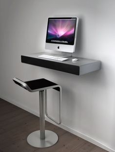 an apple computer sitting on top of a desk