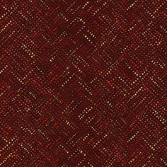 a close up view of a red and gold colored fabric textured with small squares