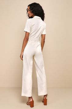 If you want to stay comfortable while looking cute, then the Lulus Practical Perfection Ivory Twill Short Sleeve Jumpsuit was made for you! Slightly stretchy woven twill shapes this trendy jumpsuit that has a collared neckline framed by short cuffed sleeves. Bodice has decorative, twin pocket flaps at the front with a functional button placket. Fitted waist features belt loops, a tying sash belt, and a hidden zip fly, all atop straight pant legs with diagonal side pockets and ankle-length hems. Chic V-neck Elastane Jumpsuits And Rompers, Chic Elastane Jumpsuits And Rompers For Spring, V-neck Elastane Jumpsuit For Work, Chic Spring Jumpsuits And Rompers, Spring Solid Color Elastane Jumpsuits And Rompers, Spring Elastane Jumpsuits And Rompers, Chic Cotton Jumpsuits And Rompers For Summer, Elegant Cotton Jumpsuits And Rompers For Summer, Chic Cotton Summer Jumpsuits And Rompers