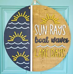 a sign that says sun rays, boat waves and lake days hanging on a door