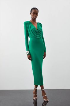 Structured and languid all at once, this dress fits the body with sculpting jersey fabric. Featuring a languid cowl neck that drapes from the neckline, while long sleeves and an A-line skirt add a structured touch. Pair with barely-there heels for timeless occasionwear.Jersey fabricCowl neckMaxi hemlineLong sleeves Crepe Fabric Dress Style, Dramatic Necklines, Jersey Fabric Dress, Aw 2024, Dinner Dresses, Soft Dramatic, Structured Dress, Beautiful Maxi Dresses, Midaxi Dress