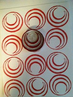 a red and white wall hanging with circles on it