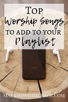 an iphone sitting on top of a tree stump with the words top worship songs to add to your playlist