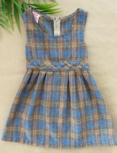 "This super cute pre-loved vintage 1960s dress by Majdell is a timeless classic. Would be a perfect autumn outfit, paired with tights and some black shoes.  Brand: Majdell  Material: 40% Acrylic, 30% Polyester, 25% Wool, 5% Other Fibers Size: 3T Made in Canada Circa 1960s Because all items in the shop are pre-loved, clothing may come with some signs of wear. I strive to be extremely transparent about imperfections, so please take a close look at the description and pictures to avoid disappointment. All items are sold \"as-is\" and all sales are final. Sorry, no returns, refunds or exchanges. If there are any issues with your order, please let me know." Vintage Plaid Dress For Fall, Fitted Retro Plaid Dress For Fall, Fitted Brown Plaid Dress For Spring, Fitted Brown Plaid Dress For Fall, 1970s Dress, Vintage Dresses 1960s, 1960s Dress, 1970s Dresses, 1960's Dress