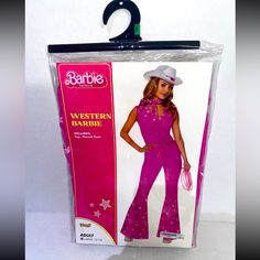 the barbie doll is wearing a pink outfit and white cowboy hat with stars on it