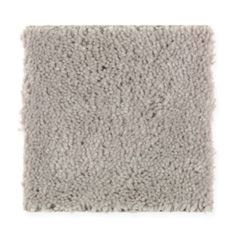 a gray carpet that is very soft and shaggyly textured with some light grey colors