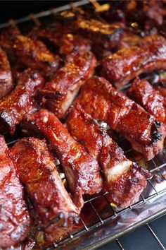 meat is being cooked on a rack in the oven