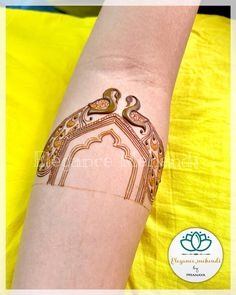 henna tattoo on the arm of a woman