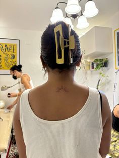 a woman with a tattoo on her back