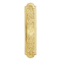 an ornate gold door handle on a white background