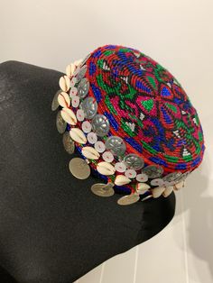 This style of hat. It is increasingly worn by tribal Pashtuns in Afghanistan and Pakistan and has began wearing it at wedding party. The hat, in traditional vintage style, has paise coins, hand-stitched onto it. Traditional Adjustable Multicolor Turban, Traditional Adjustable Turban For Festivals, Traditional Adjustable Festival Turban, Adjustable Traditional Turban For Festivals, Traditional Multicolor Beaded Hat, Traditional Multicolor Headpieces For Festivals, Bohemian Multicolor Turban For Festivals, Traditional Multicolor Hats For Festivals, Traditional Multicolor Festival Hats