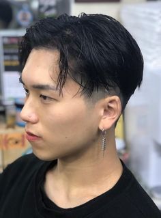 The K-pop style needs no introduction. It is the classic ‘rolled out of bed look’ coupled with casually layered hair. It is a versatile look and can be styled casually or professionally. Long At The Front Short At The Back Hair, Modern Mullet For Asian Men, Slicked Back Black Hair Men, K Pop Haircut Men, K Pop Men Hairstyle, K Pop Mullet, Asian Modern Mullet, Hair Cut Man