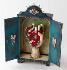 Whimsical folk-art shrine with heart and hand symbols Shadow Box Art, Found Object Art, Tin Art, Assemblage Art, Mexican Art, Mexican Folk Art