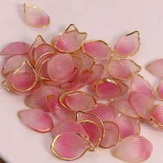 pink and gold glass flowers on a white plate