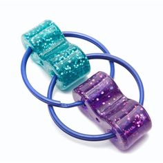 two blue and one purple ring with glitters on them, sitting next to each other