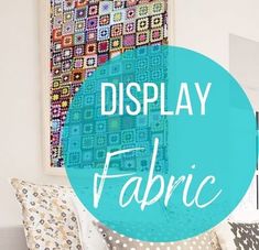 the words display fabric are displayed in front of a couch with pillows and blankets on it