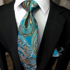 The tie is expertly crafted, with a sleek design that is perfect for a professional look. The pocket square is made with the same silk material and features the same vibrant paisley design, making it the perfect match for the tie. The cufflinks feature a subtle paisley design, adding a subtle touch of style to your formal attire. 100% Silk Handmade Package Includes: Tie, Pocket Square & Cufflinks. Length: 59" Width: 3.34" Warm iron if needed Luxury Classic Ties With Paisley Print, Luxury Multicolor Ties For Men, Luxury Elegant Paisley Print Ties, Unique Ties, Cufflink Set, Dressed To Kill, Tie Set, Silk Material, Paisley Design