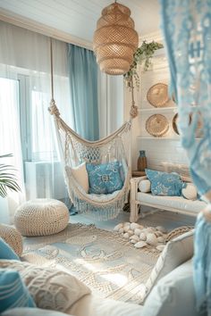 a living room filled with lots of white furniture and blue curtains on the windowsill