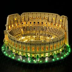 a model of a roman colossion with lights on it's sides and columns