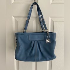 New With Tags. I Purchased Too Much Coach Over The Years And My Daughter Tells Me I Need To Pair Down:) Soft Blue Leather With Silver Hardware And Included Extra Coach Horse And Carriage Key Fob/Charm. Bag Is No Longer Made And Has Been Sitting In A Well Conditioned Room. Side Pockets To Hold Water Or Wipes. Interior Has A Zippered Compartment. Clean And Needs A Good Home Blue Leather Shoulder Bag With Palladium Hardware, Classic Blue Bags With Silver-tone Hardware, Coach Blue Shoulder Bag With Silver-tone Hardware, Formal Blue Shoulder Bag With Silver-tone Hardware, Elegant Blue Bag With Silver-tone Hardware, Elegant Blue Bags With Silver-tone Hardware, Blue Coach Bag With Branded Hardware, Blue Bags With Silver-tone Hardware For Daily Use, Blue Tote Shoulder Bag With Silver-tone Hardware