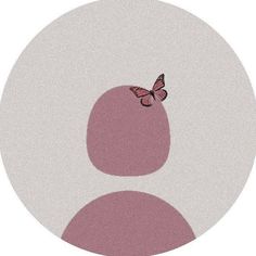 a pink and white circle with a butterfly on the top, in front of it