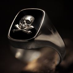 "Considered the \"gentleman's ring\", there doesn't seem to be a more perfect piece of jewelry to proudly wear than our sterling silver signet ring. Our Gentleman's ring is a very unique piece with a straight oval Onyx stone set within. On top of the Onyx sits a sterling silver skull and crossbones design. Shipping&Processing Since all our items are individually handmade, we need about 4 weeks (at most) to make your item. Shipping is on us, we use DHL express so it will only take 3 days on a Luxury Gold Signet Ring Collectible, 14k Gold Signet Ring With Polished Finish, Modern Engraved Signet Ring For Formal Occasions, Luxury Gold Signet Ring For Formal Occasions, Timeless Gold Engraved Ring, Formal Gold Engraved Ring, Timeless Tarnish Resistant Signet Ring For Formal Occasions, Luxury Tarnish Resistant Rings For Formal Occasions, Timeless Gold Signet Ring