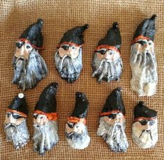 seven gnomes with black hats and orange ties