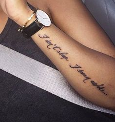 a woman with a tattoo on her arm that reads, i can't wait for you