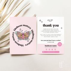 a pink greeting card with a butterfly on it and the words thank you written below