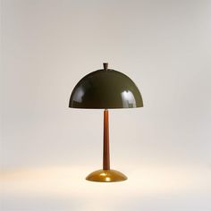 a green table lamp on a white background