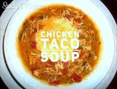 chicken taco soup in a white bowl with the words chicken taco soup on it