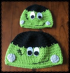 two crocheted hats with googly eyes on them