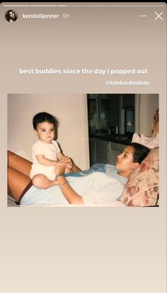 a woman laying in bed with a baby on her lap and the caption reads, best buddies since the day i popped out