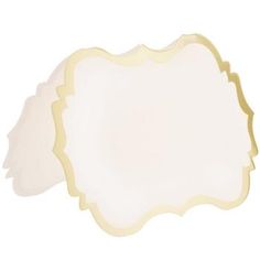 an empty white plate with gold trimmings on the edges and a scalloped edge