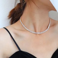 Elevate your neck game with this exquisite Tennis necklace, a stunning piece that exudes elegance and glamour. Meticulously crafted with high-quality stainless steel, this beauty ensures long-lasting durability and fade-free shine. Adorned with clear or green cubic zirconia stones, it glistens with an alluring sparkle that is sure to turn heads. The heavy layer of 18K gold adds a touch of luxury and leaves a thick layer to prevent any wearing off. With its perfect fit size of 41cm, this necklace Elegant Luxury Heavy Necklace, Luxury Gold Cubic Zirconia Choker, Luxury Diamond Choker Necklace, Luxury Gold Cubic Zirconia Tennis Necklace, Luxury Cubic Zirconia Tennis Necklace, Luxury Sparkling Stones Choker Necklace, Luxury Cubic Zirconia Tennis Necklace With Sparkling Stones, Luxury Clear Necklace, Luxury Choker Necklace With Sparkling Stones