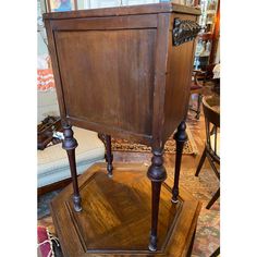 an old wooden cabinet sitting on top of a hard wood floor