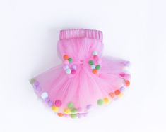 Pom pom tutu skirt for girls 0-8 years. Welcome to the world of magical kids skirts! Introducing the Pom Pom Tutu Skirt for Girls, the perfect combination of style and comfort! These tutu skirts for little girls will make your little one a star at her next event. Your child can now shine and sparkle in their own special way. These tulle tutu skirts provide the perfect combination of fun and fashion for any occasion. Our tutu skirt is designed with five layers of tulle and satin lining for ultima Pom Pom Tutu, Pom Pom Bow, Confetti Cupcakes, Purple Hair Bows, Bow Hair Tie, Tutu Skirt Kids, Pink Tutu Skirt, Pink Pom Pom, Kids Tutu