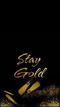 the words stay gold are written in gold on a black background with some yellow glitter