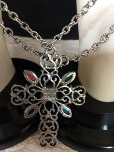 Avon silver tone filigree cross with faux colored stones on a 24 inch silver tone chain Avon Cross Necklace, Port Huron, Colored Stones, Pendant Necklaces, Stone Color, Silver Tone, Statement Necklace, Chain Necklace, Necklaces