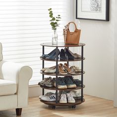 there is a shoe rack with many pairs of shoes on it in the living room