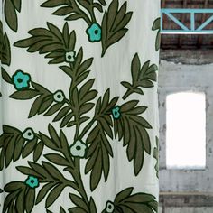 a curtain with green and blue flowers on it