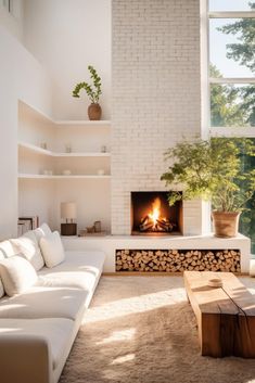 a living room filled with furniture and a fire place next to a large window on top of a wall