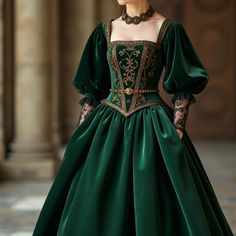 Immerse yourself in the elegance of this Tudor-inspired gown, beautifully crafted in a deep emerald green with intricate bronze embroidery. The bodice showcases a stunning vine motif, while the voluminous velvet skirt flows with regal grace. Short, puffed sleeves taper into delicate lace cuffs, adding a modern twist to the historical design. A bronze belt with ornate clasps completes the look, blending strength with sophistication. This majestic gown, in a striking emerald and bronze palette, evokes power and opulence, all brought to life in stunning 16K HD clarity.#TudorGown #EmeraldGreenGown #BronzeEmbroidery #VelvetDress #RegalFashion #LuxuryAttire #HistoricalFashion #ElegantDesign #RoyalGown #OpulentStyle #MedievalFashion #NobleStyle #16KHD #AristocraticFashion Tudor Inspired Modern Fashion, Green Dress Aesthetic Royal, Modern Medieval Outfit, Green Royalcore, Green And Silver Dress, Medieval Bodice, Medieval Ball Gown, Dark Green Ball Gown, Green Medieval Dress