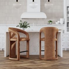 two chairs sitting next to each other in front of a counter