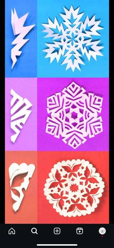 paper snowflakes are arranged in different colors and shapes, including one with an arrow